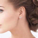 1/10 Ctw Petite Snowflake Round Cut Diamond Fashion Stud Earrings in 10K White Gold