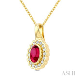 6X4 MM Oval Shape Ruby and 1/6 Ctw Round Cut Diamond Bold Precious Pendant With Chain in 10K Yellow Gold